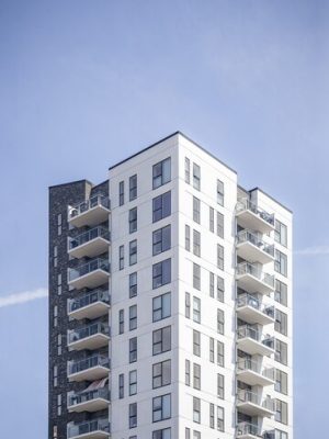 vertical-shot-white-building-clear-sky_181624-4575